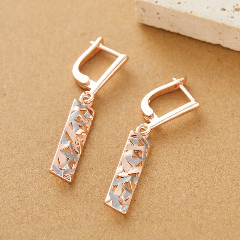 Rectangular two-tone hollow stud earrings with geometric design and electroplated alloy construction