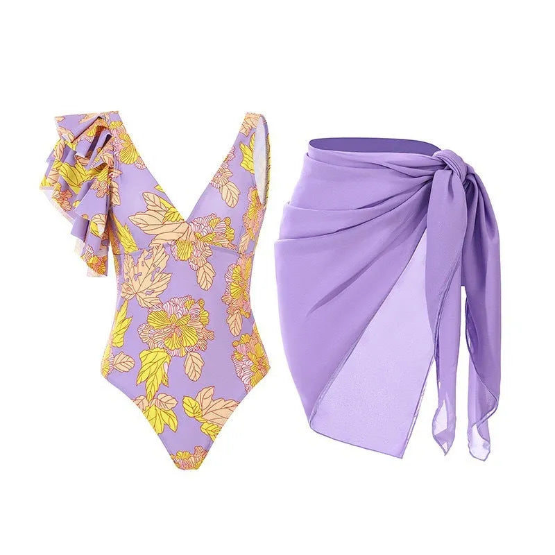 Solid colour women's one-piece swimsuit with spaghetti straps and an attached skirt.