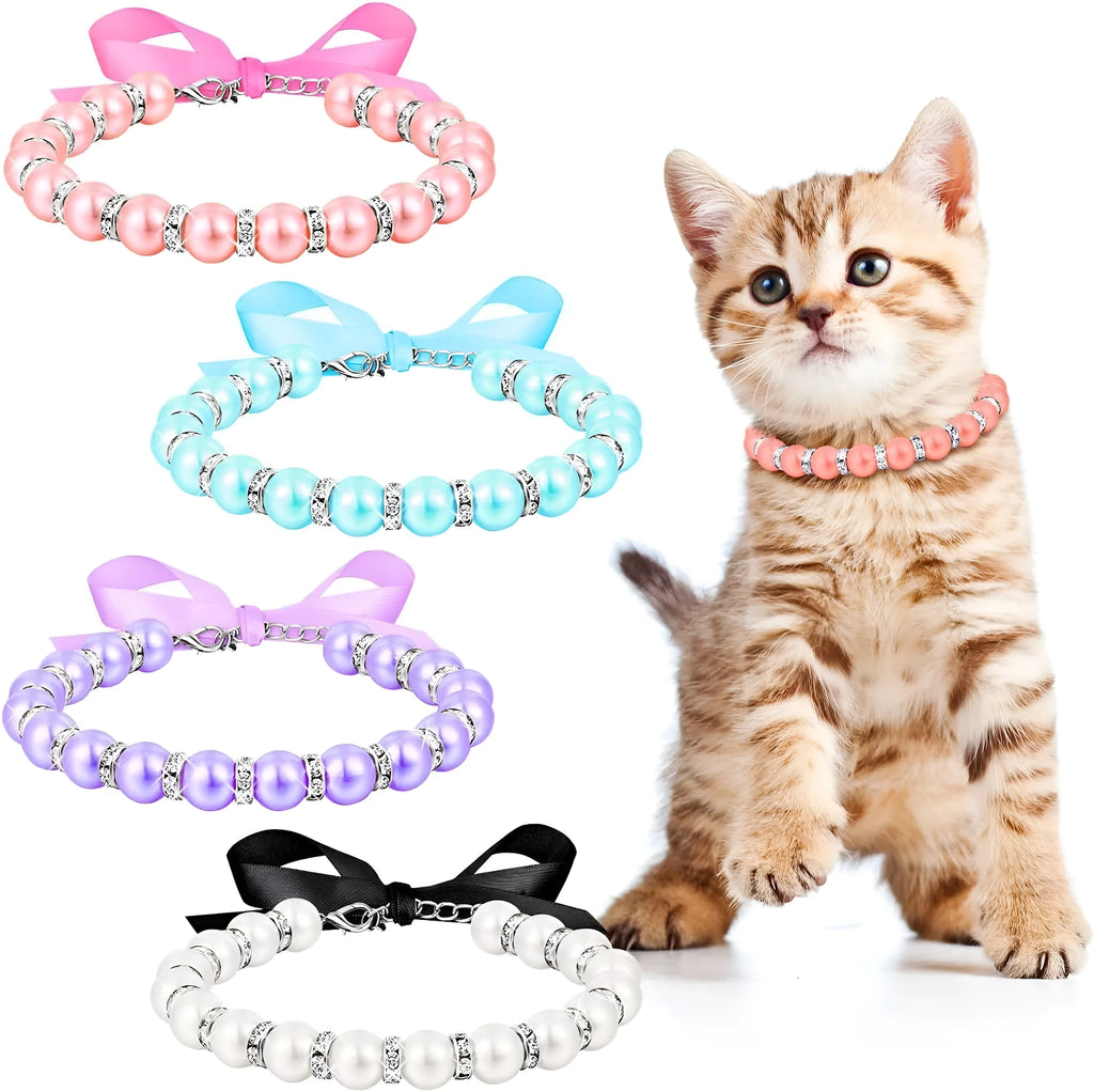 Small dog wearing adjustable blue imitation pearl and rhinestone necklace with ribbon bow