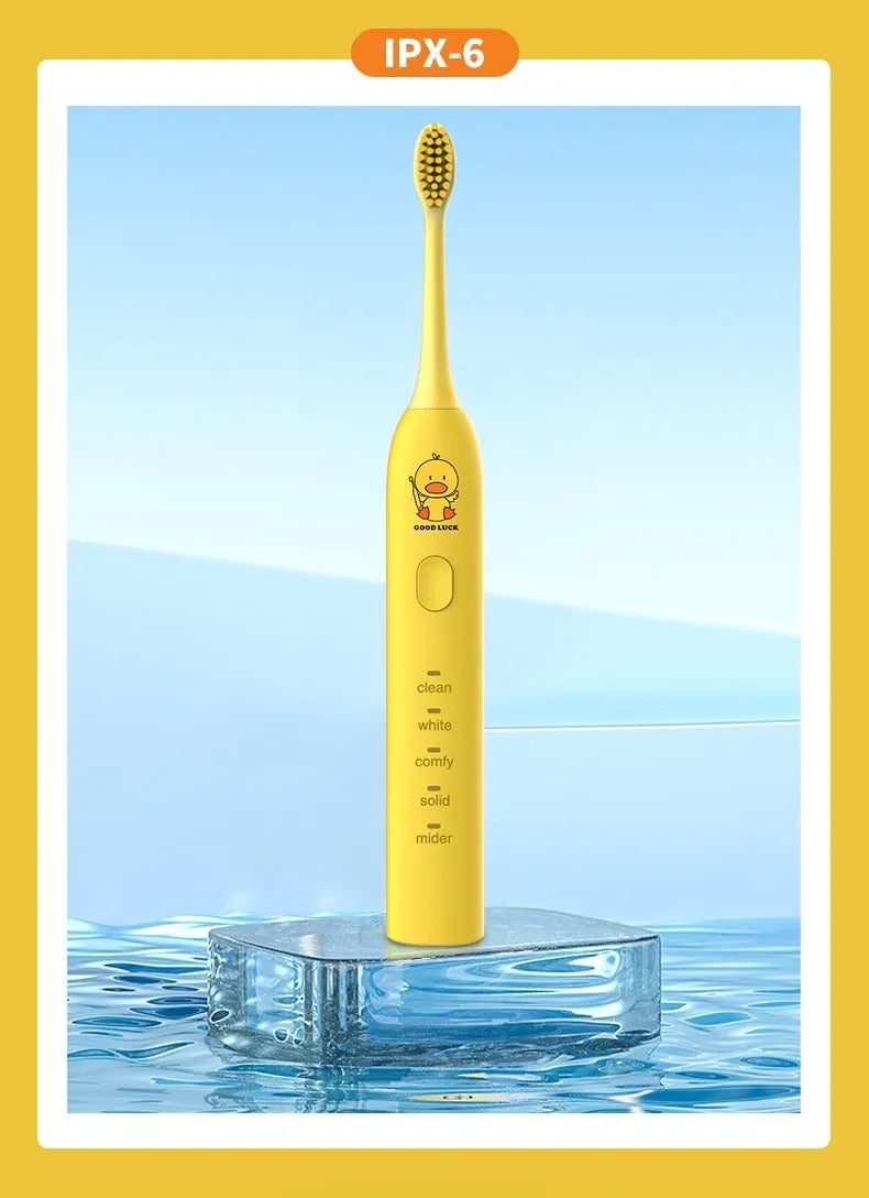 Small yellow duck electric toothbrush with soft bristles and USB charging in green pink and yellow colours