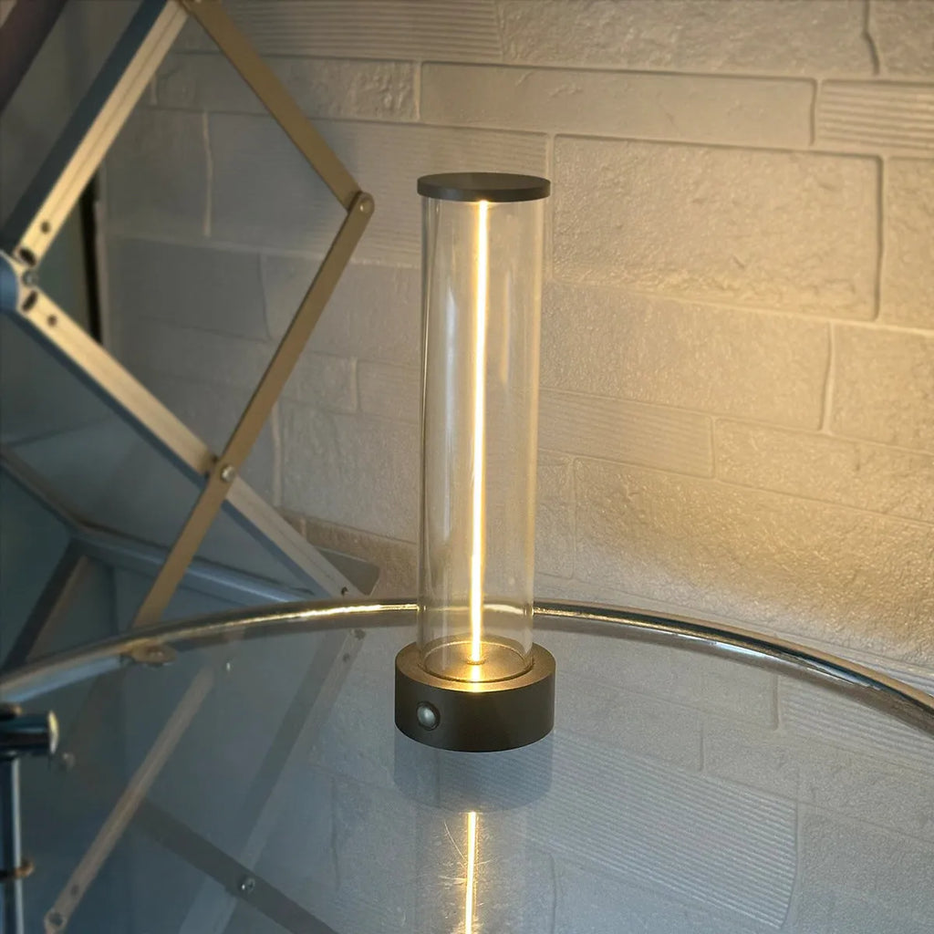 Modern glass and metal LED line light strip with magnetic back for USB-charged night lighting