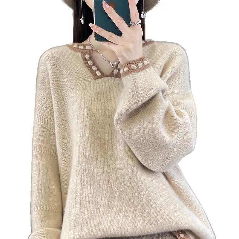 Women's camel coloured V-neck viscose pullover sweater with long sleeves on a hanger.