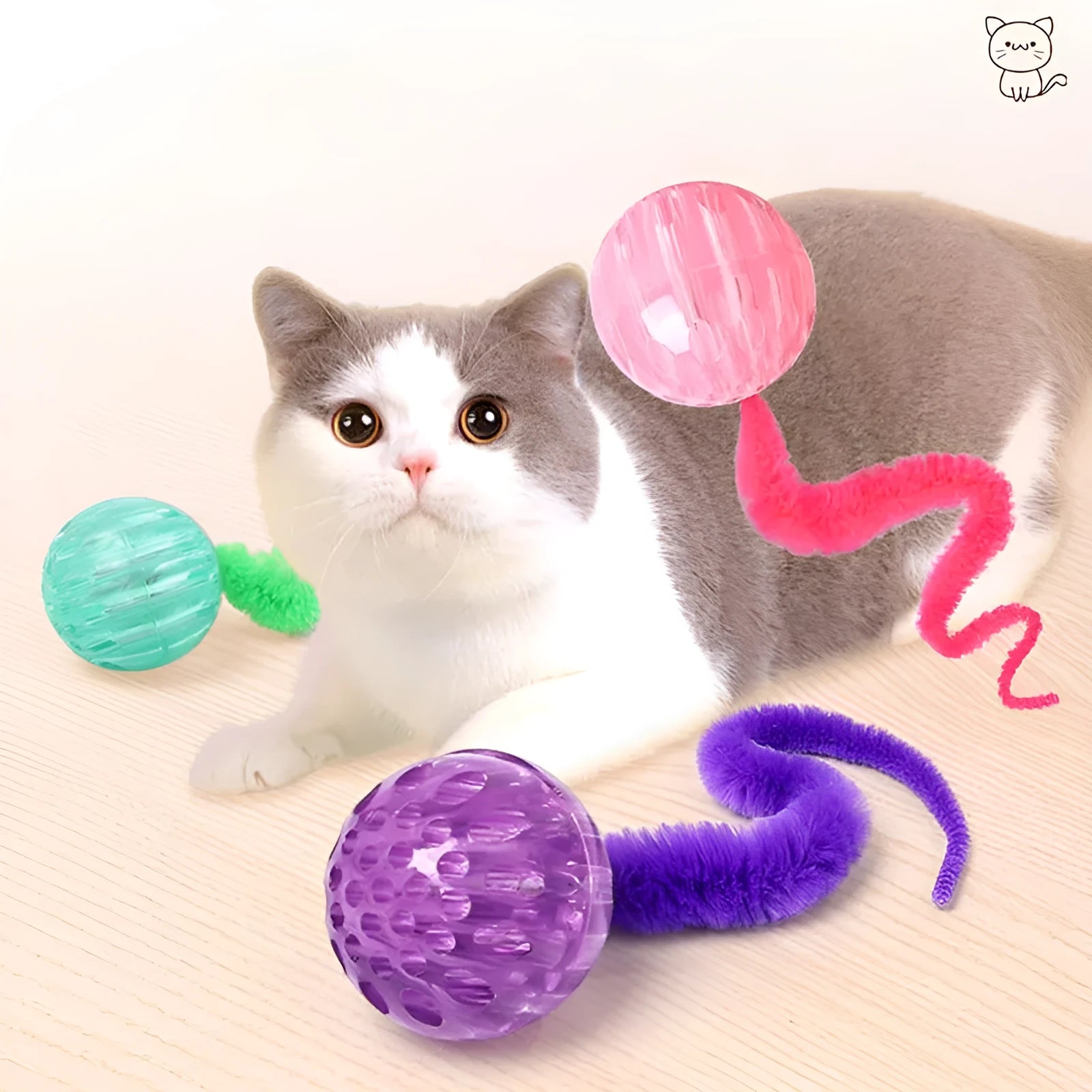 Green interactive cat toy featuring a bouncy ball with a long plush tail on a wooden floor.