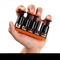 Grey and orange non-slip silicone finger trainer for guzheng, piano, and guitar practice.