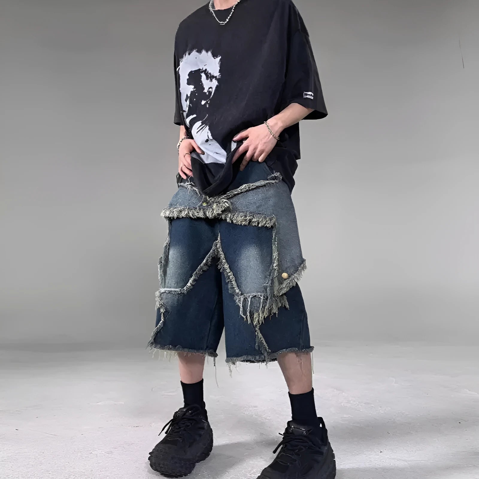Blue denim shorts with five-pointed star detailing and frayed edges in loose fit style