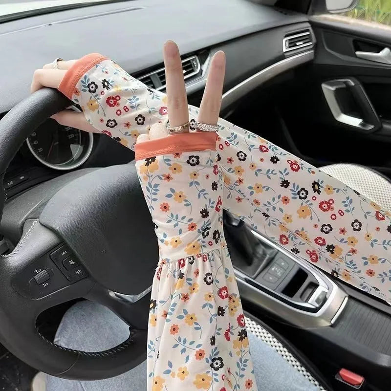 A pair of printed viscose ice silk sun protection sleeve gloves covering the forearm and elbow.