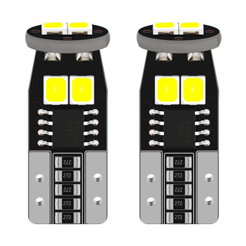 Small white LED car lamp for licence plate lighting on a fibre-glass board.