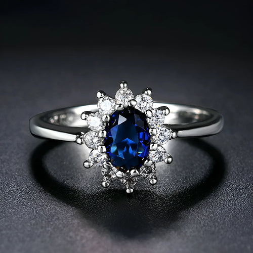 Blue moissanite women's copper ring with floral zirconium stone on a simple band, shown in three colour options.