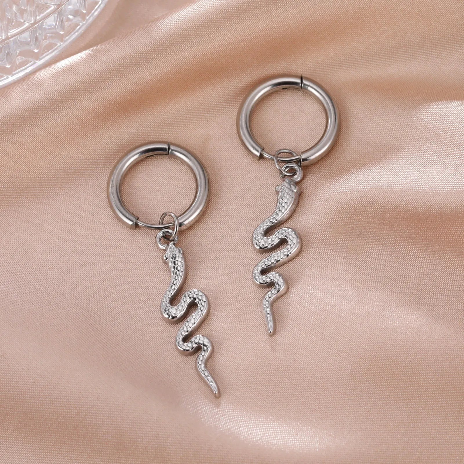 Gold plated stainless steel snake-shaped vintage clip-on earrings for women.