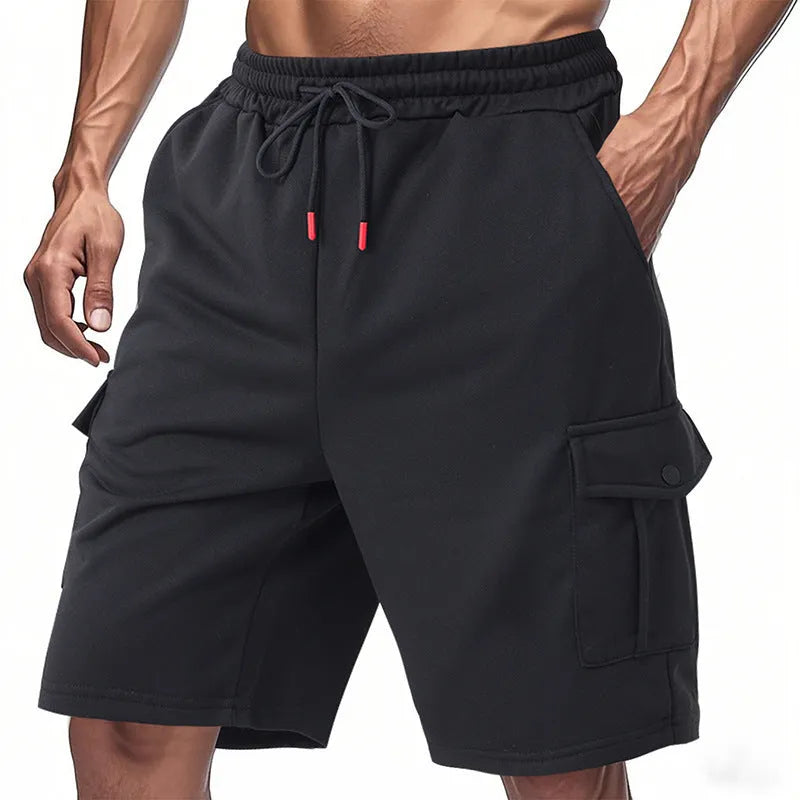 Man's light grey loose-fit cargo shorts made from heavy towel fabric with multiple pockets.
