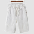 Men's linen shorts in loose cropped design with elastic waistband, shown in available colours