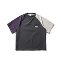 Dark grey men's loose fit T-shirt with contrast colour panels and raglan sleeves.