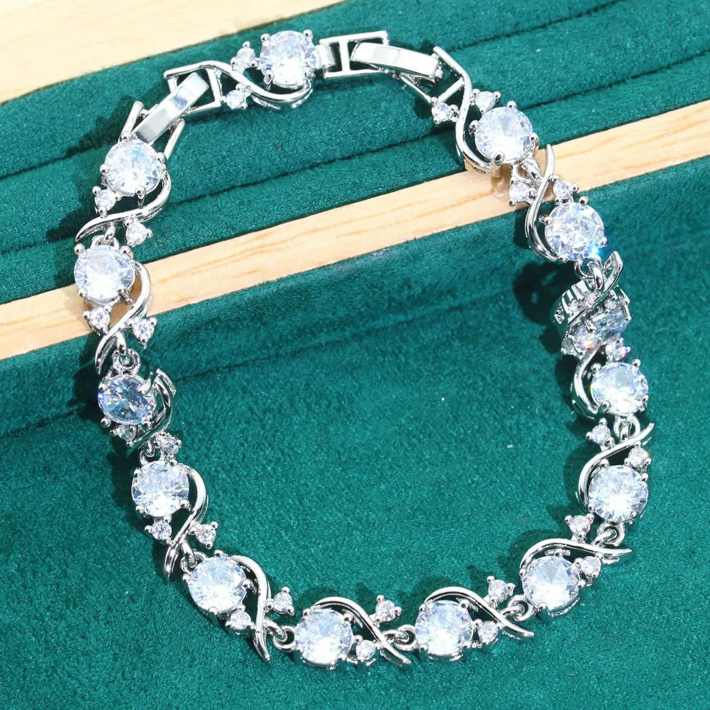 Four-piece bridal jewellery set with necklace, bracelet, earrings, and ring in alloy with zircon detail