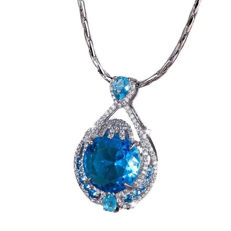 Women's geometric necklace with blue crystal gems on water wave chain