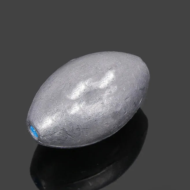 Plastic core olive fishing sinker with rugby shape and scale markings for sea fishing