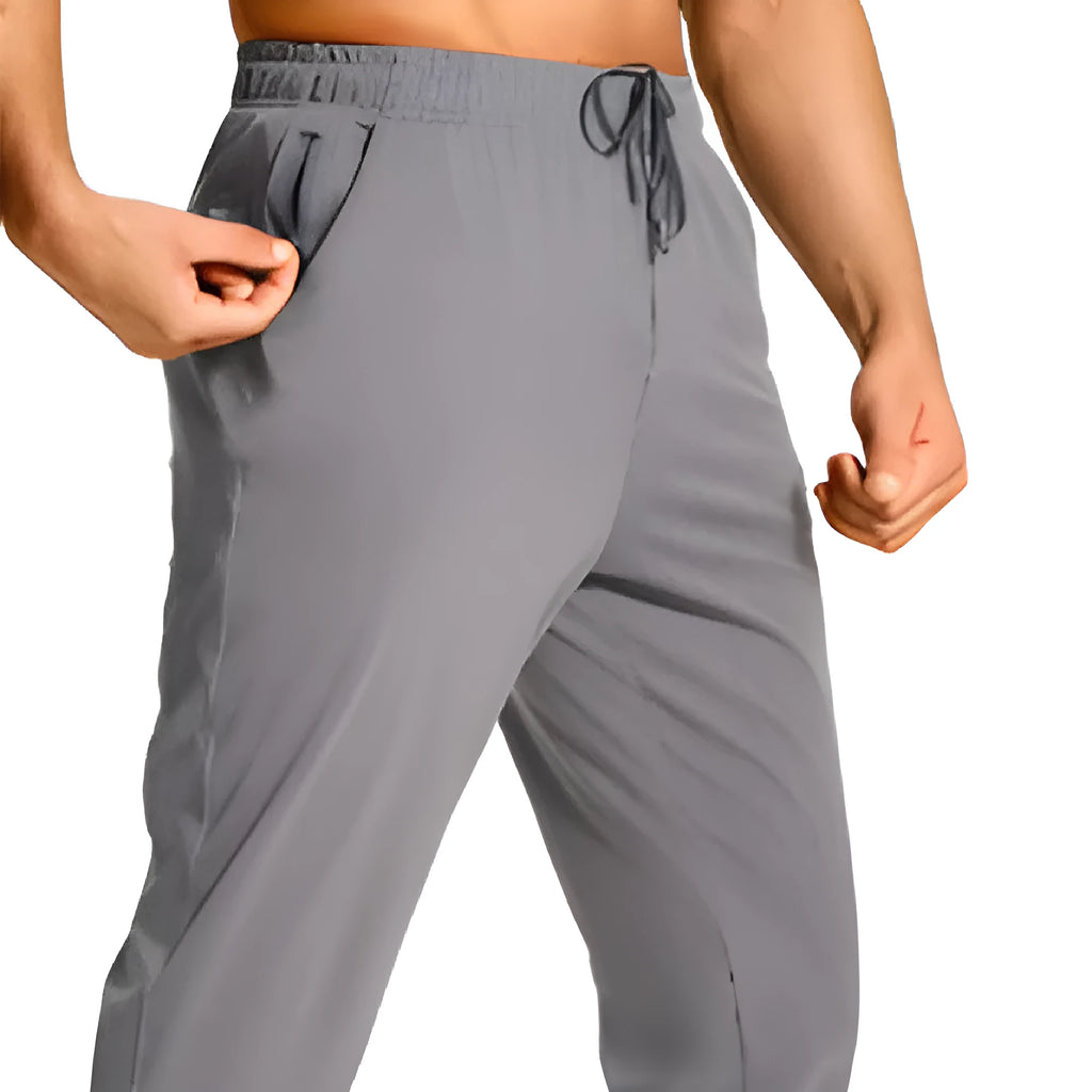 Men's loose-fit solid colour casual trousers on a hanger, showing the relaxed leg cut.