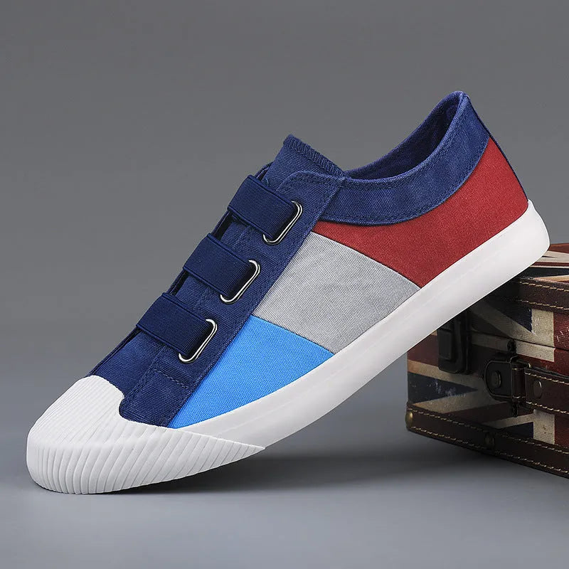 Men's beige canvas low-top sneakers with elastic band fastening and a vulcanised rubber sole.