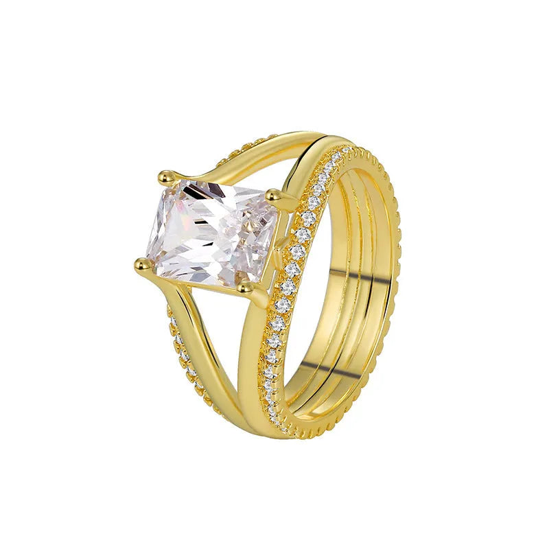 Geometric gold-coloured women's ring with square zircon stone on copper band