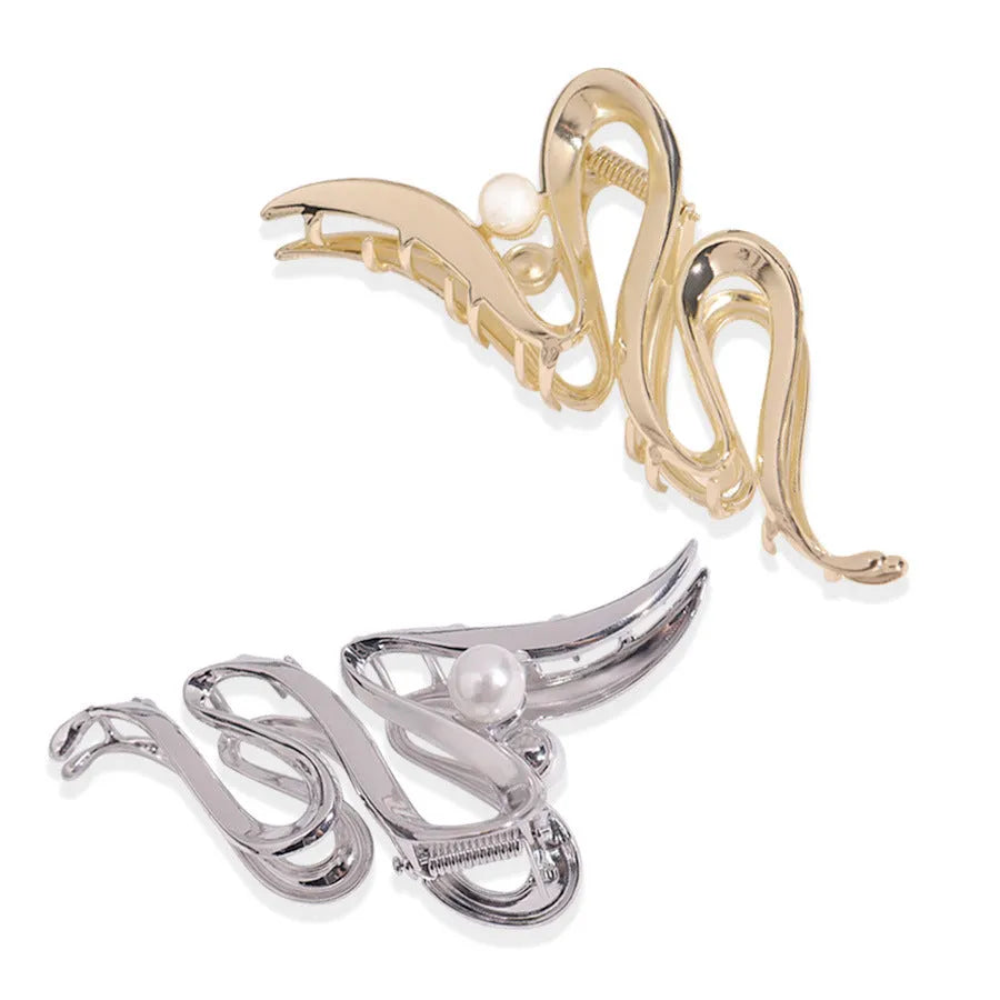 Silver metal hair claw clip assortment showing bows, waves, pearl designs, and geometric shapes from 4cm to 13.5cm
