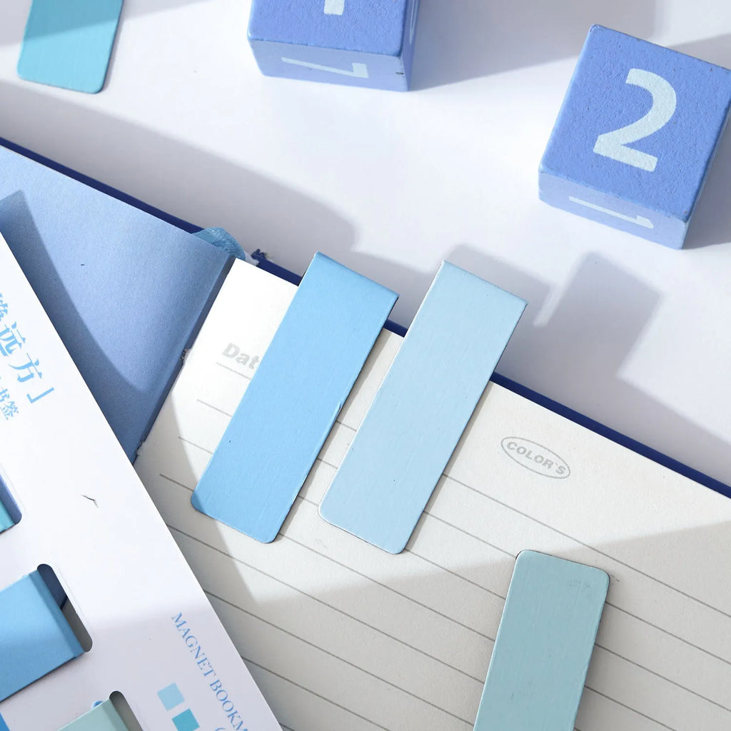 Set of four Morandi colour magnetic bookmarks showing miniature size and magnetic closure design