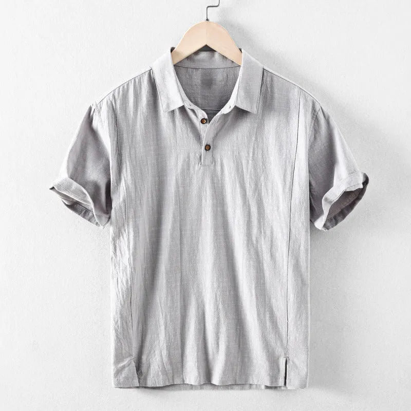 Man wearing a loose fit, light grey linen casual shirt.