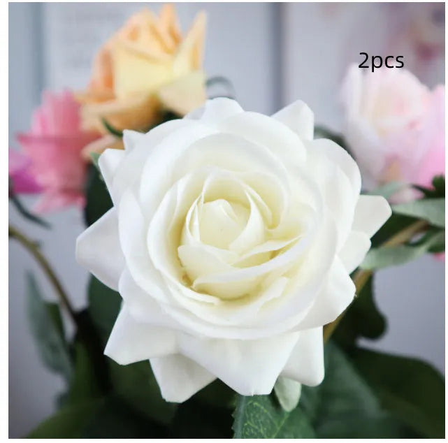 Artificial silk rose bouquet with red fabric flower head and green plastic stem