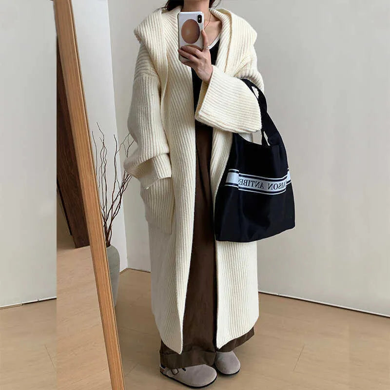 Loose hooded acrylic cardigan sweatshirt in milky white colour showing raglan sleeves and 80cm length