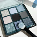 MUGELEEN nine-colour eye shadow palette showing blue smoked and earth tone shades