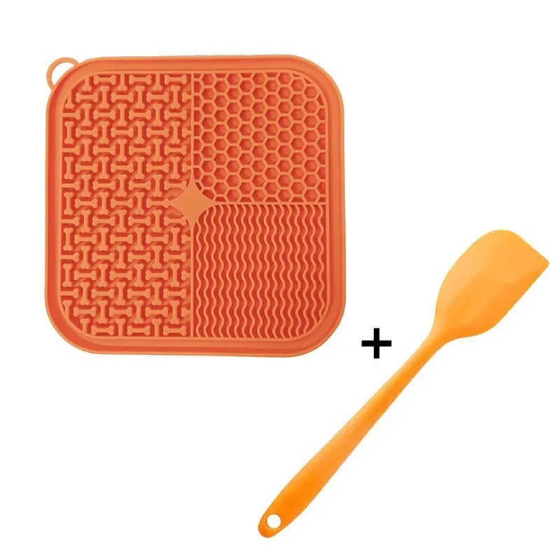 Blue silicone dog licking mat with textured surface and suction cups on back.