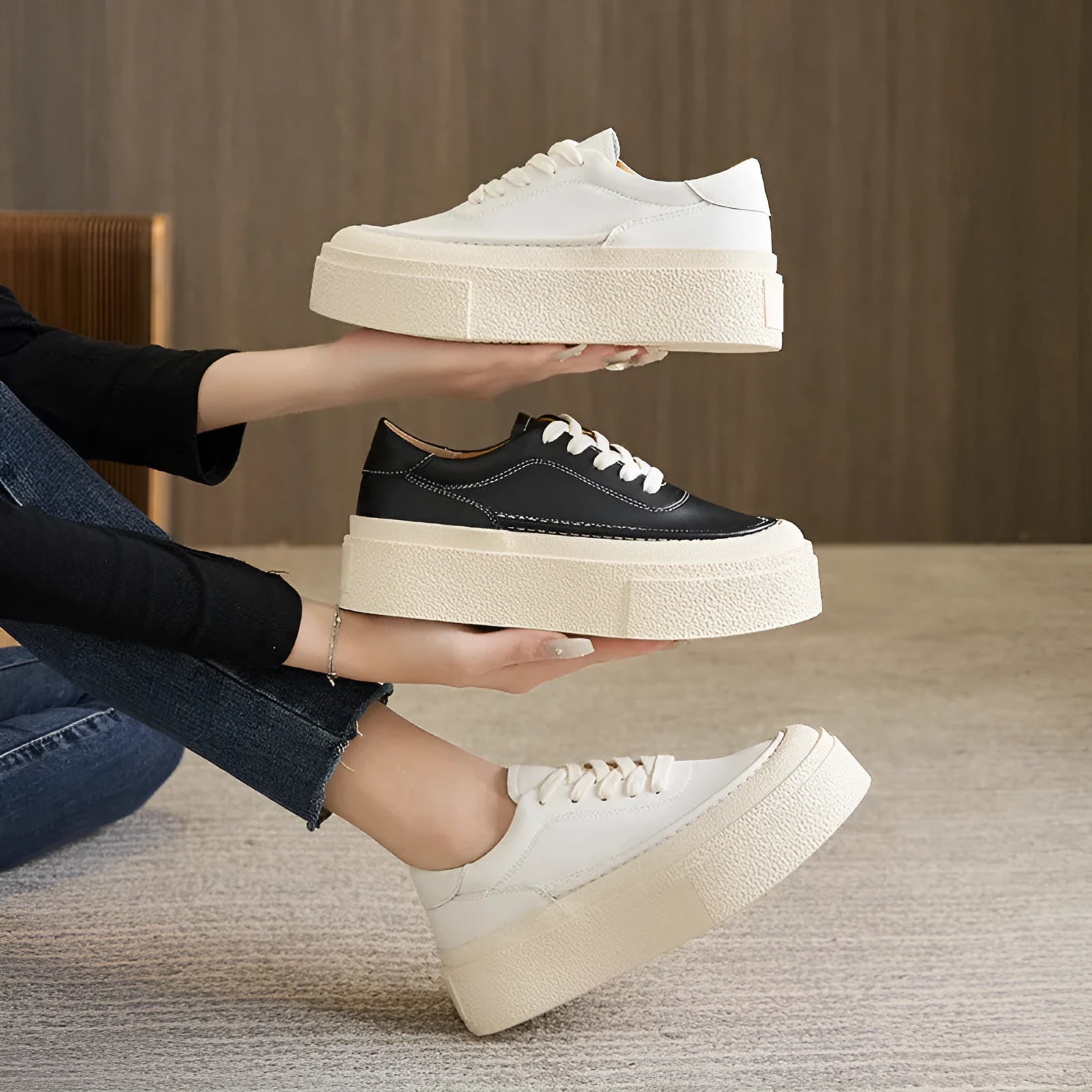 Women's black platform casual board shoes with embossed cowhide upper and round toe design