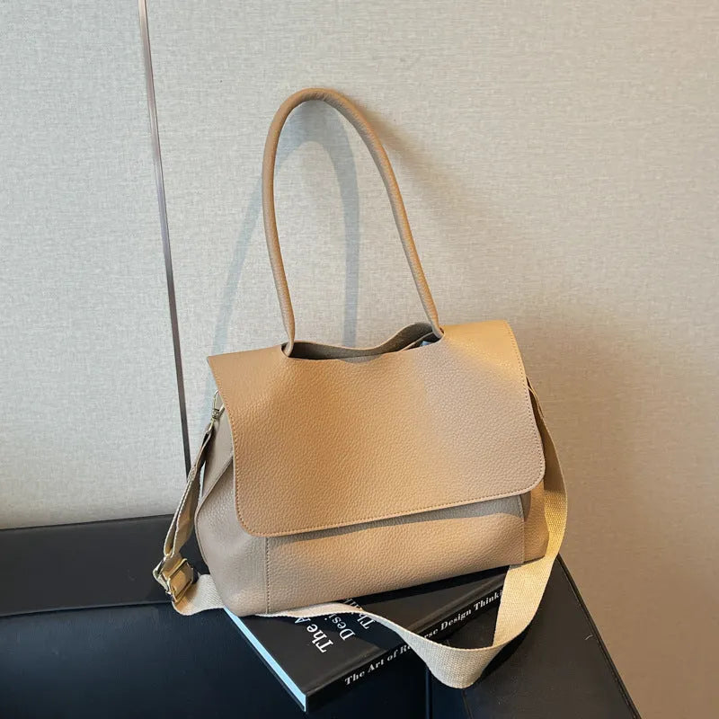 Square synthetic leather tote bag with double straps in a neutral colour.