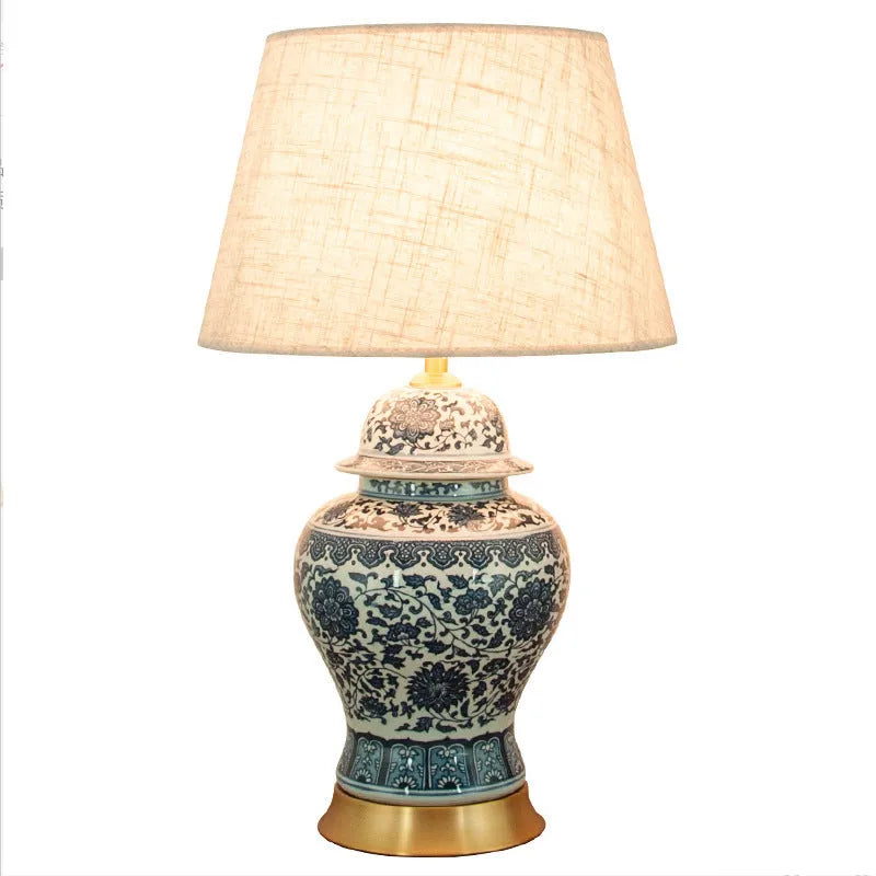 Chinese blue and white porcelain table lamp with copper base and cloth shade