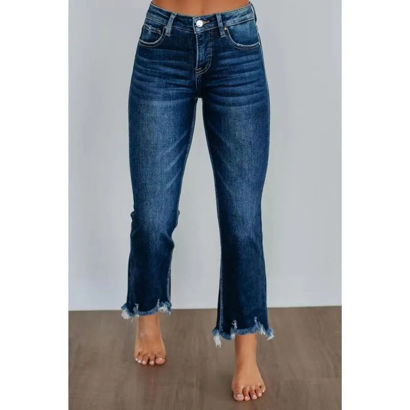 Women's solid colour denim jeans on a hanger showing hand-worn texture and available in dark blue and light blue
