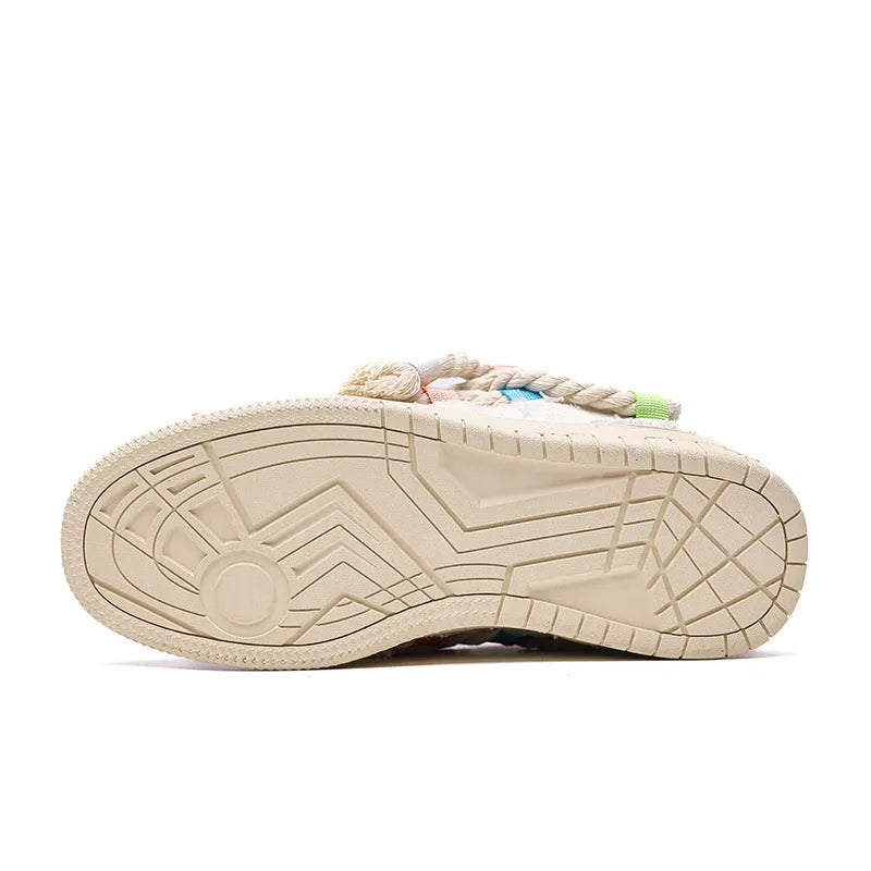 Creamy white retro low-top skateboard shoes with platform heel and lace-up front.