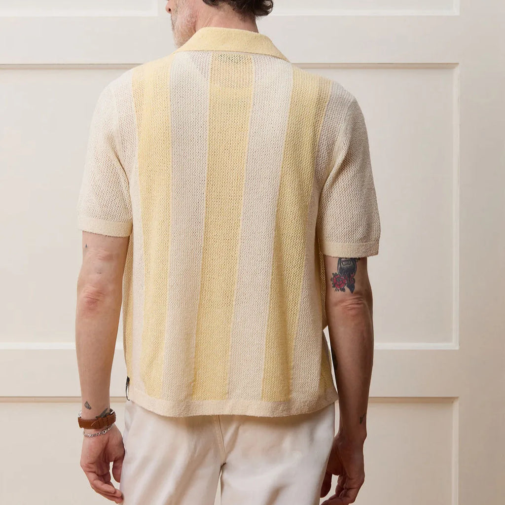 Yellow men's polo shirt with asymmetric design and short sleeves made from Tencel fabric