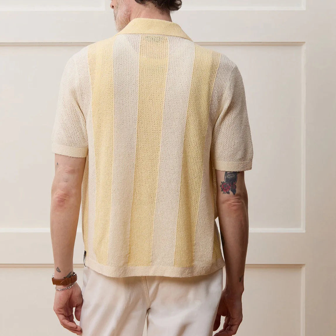 Yellow men's polo shirt with asymmetric design and short sleeves made from Tencel fabric