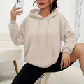 A loose-fitting women's long-sleeve sweatshirt with a drawstring pocket, shown in a solid colour.