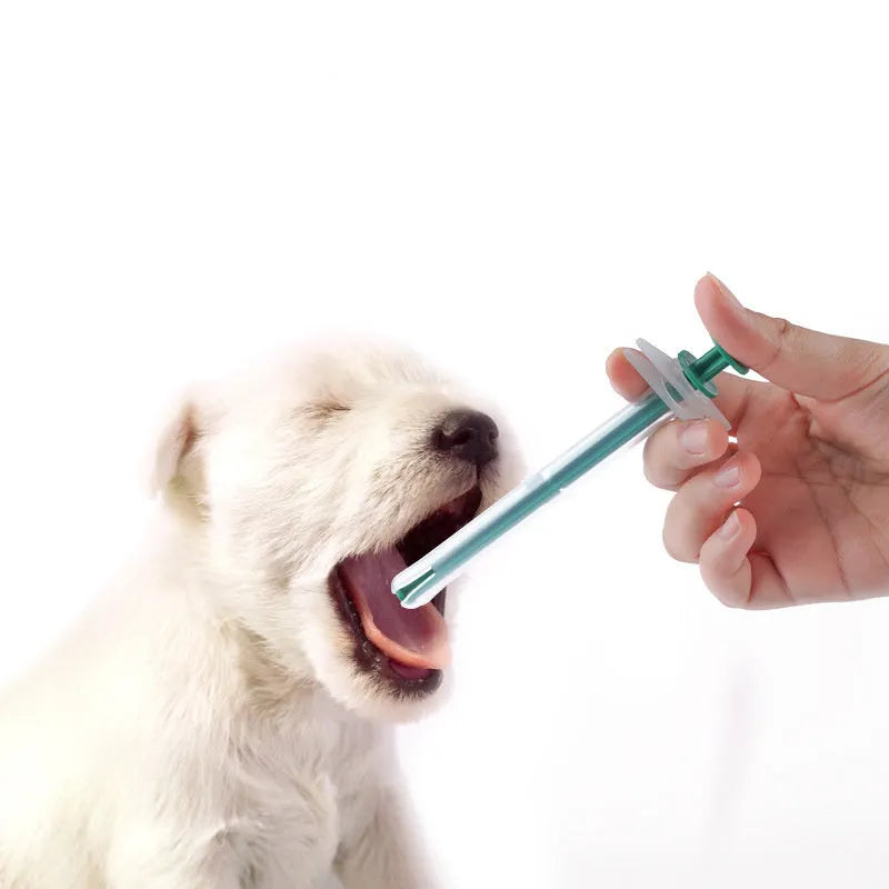 Two soft-tip silica gel pet pill shooters for cats and dogs on a white background