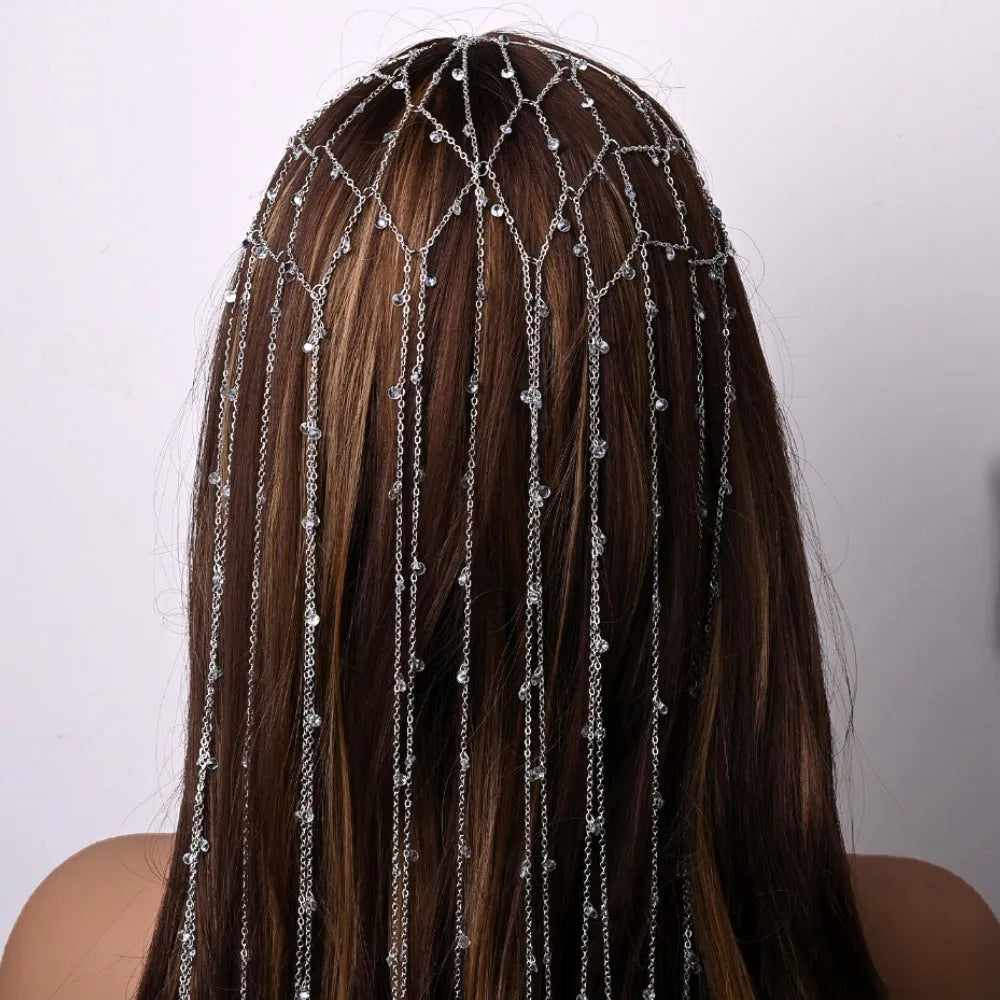 Gold and silver rhinestone mesh headband with hanging tassel details.