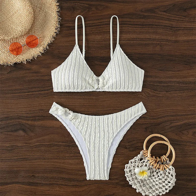White women's V-neck swimsuit with split design and matching shorts