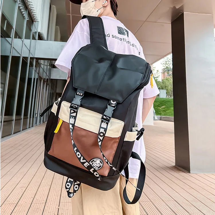 Oxford cloth backpack shown in black, green, or red, featuring multiple carry handles and straps.
