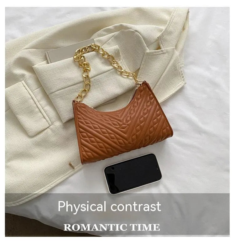 Brown pleated chain baguette shoulder bag showing vertical square shape and adjustable 50cm strap