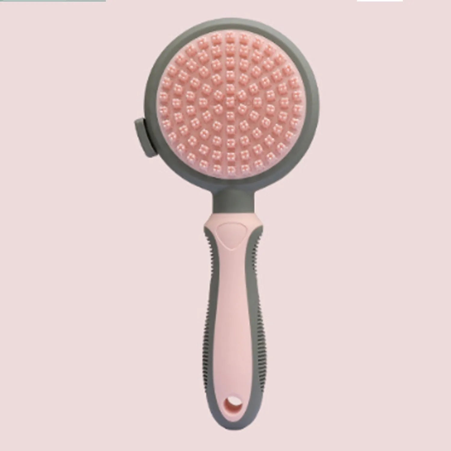 Double-sided cat grooming brush with release button in green and pink colour options
