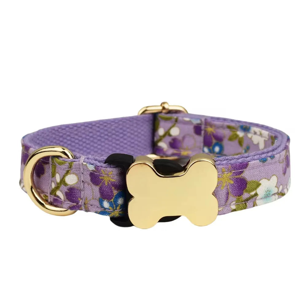 Nylon dog collar with printed grid pattern and a bone-shaped metal buckle in a selected colour.