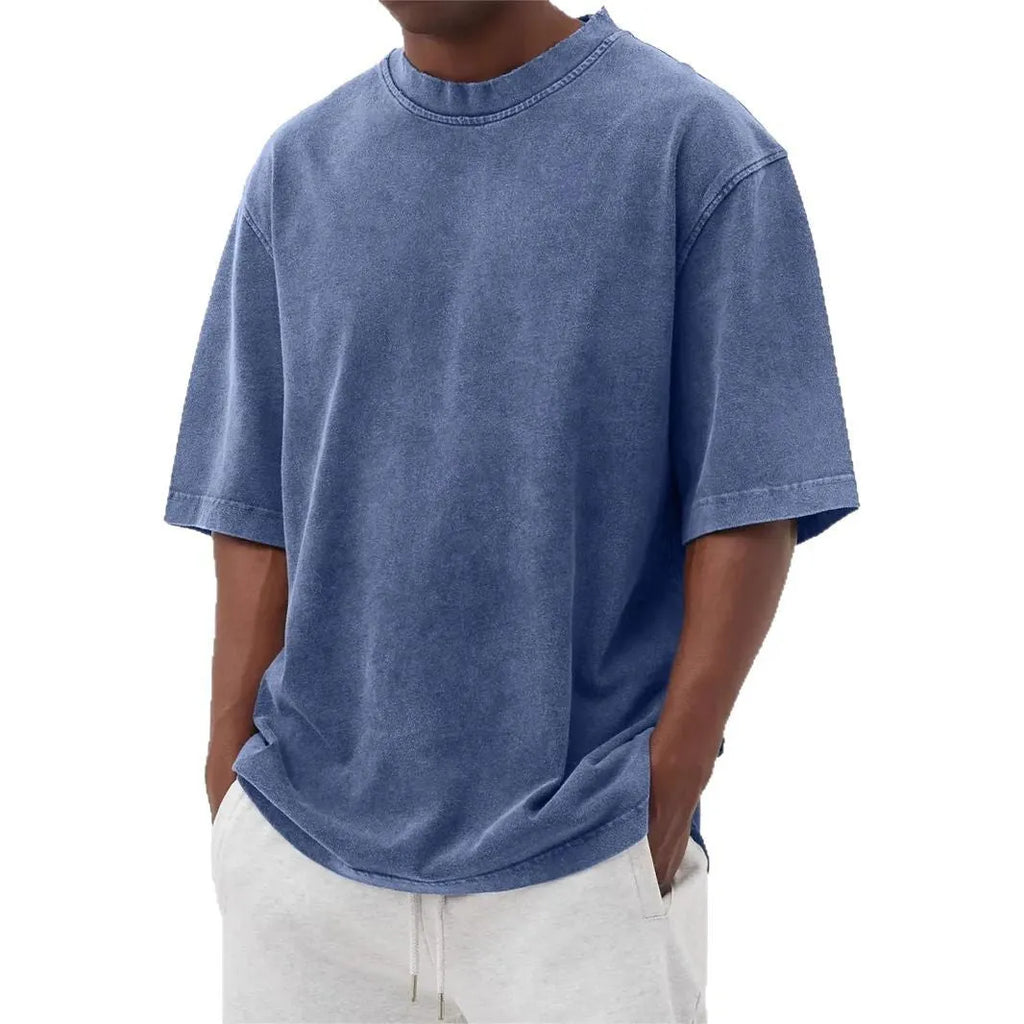 Men's loose fit pullover T-shirt in a stone-washed distressed solid colour, shown in army green.