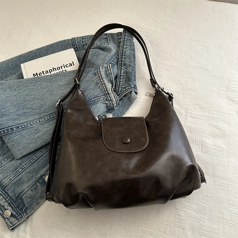 Women's black PU leather single shoulder bag with horizontal square shape and dedicated phone compartment