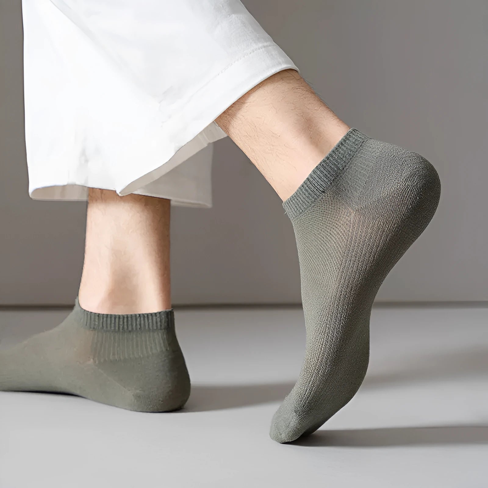 Low-cut polyester boat socks in solid colour on foot showing discreet design below ankle