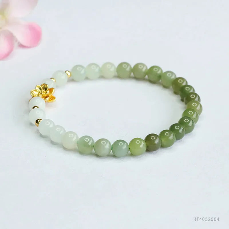 Hand-woven Hetian jade bracelet with sunshine water gradient colour and floral bead design.