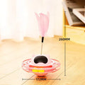 Pink cat tumbler turntable toy measuring 17cm tall with four play options