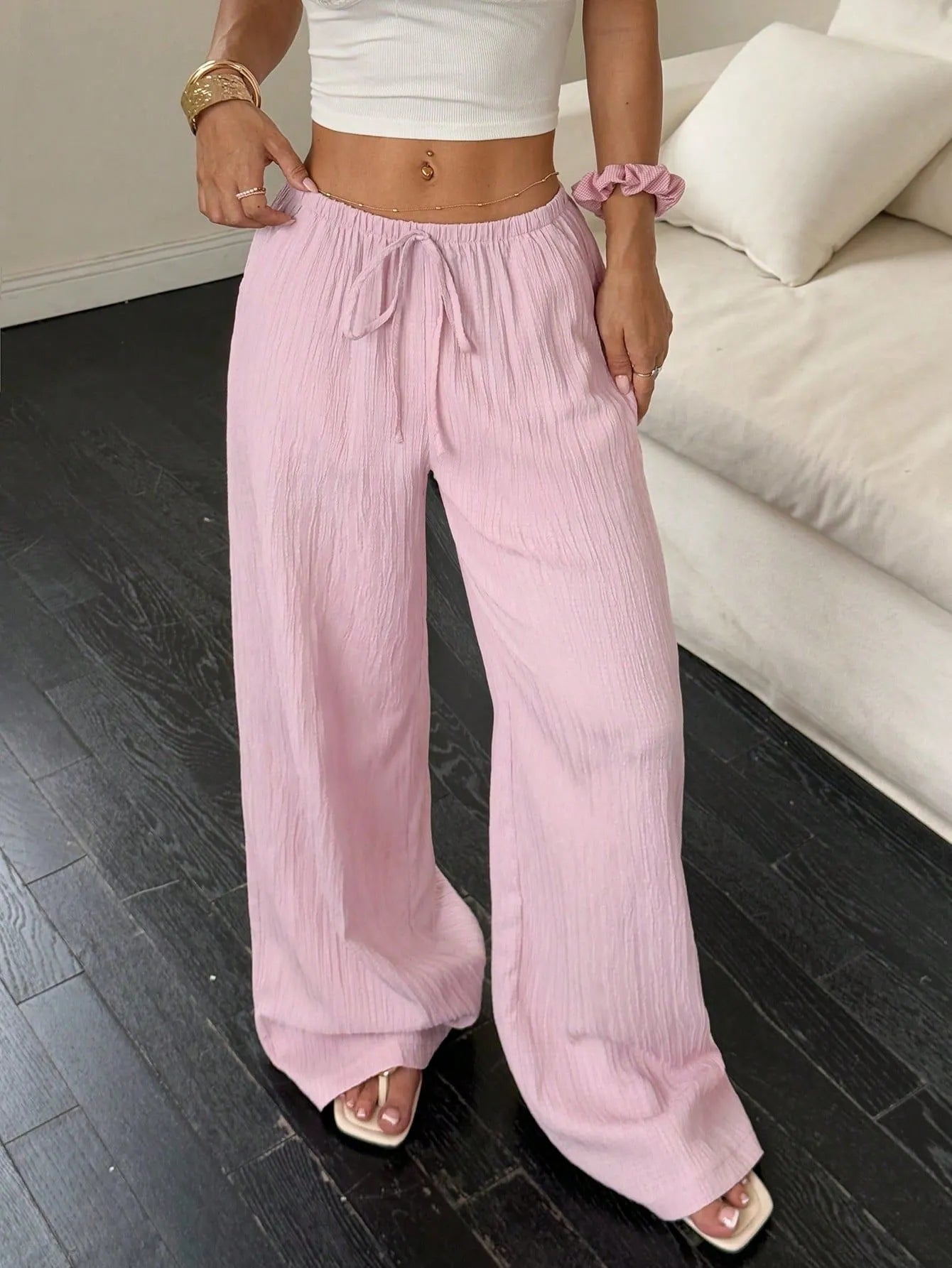 Women's wide-leg trousers with lace-up waist trimming in black and pink polyester fabric